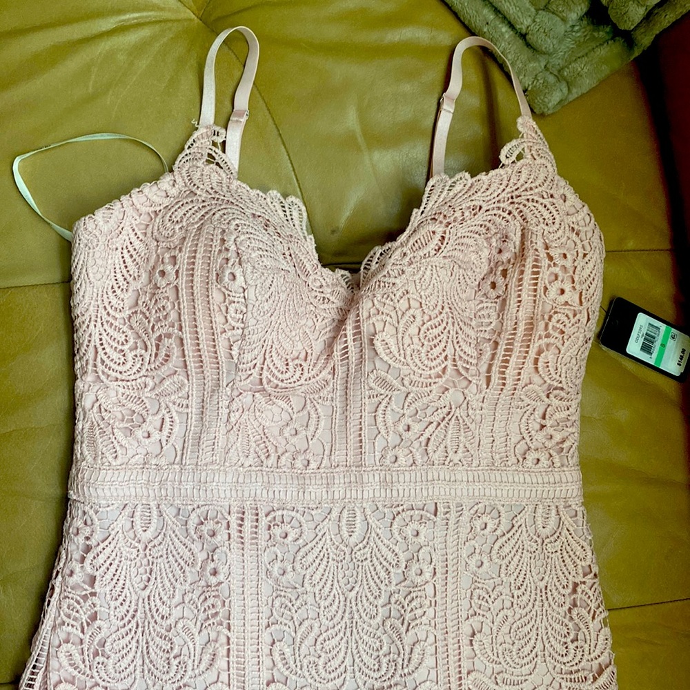 Size 8 coral color dress two straps. With flare at bottom form